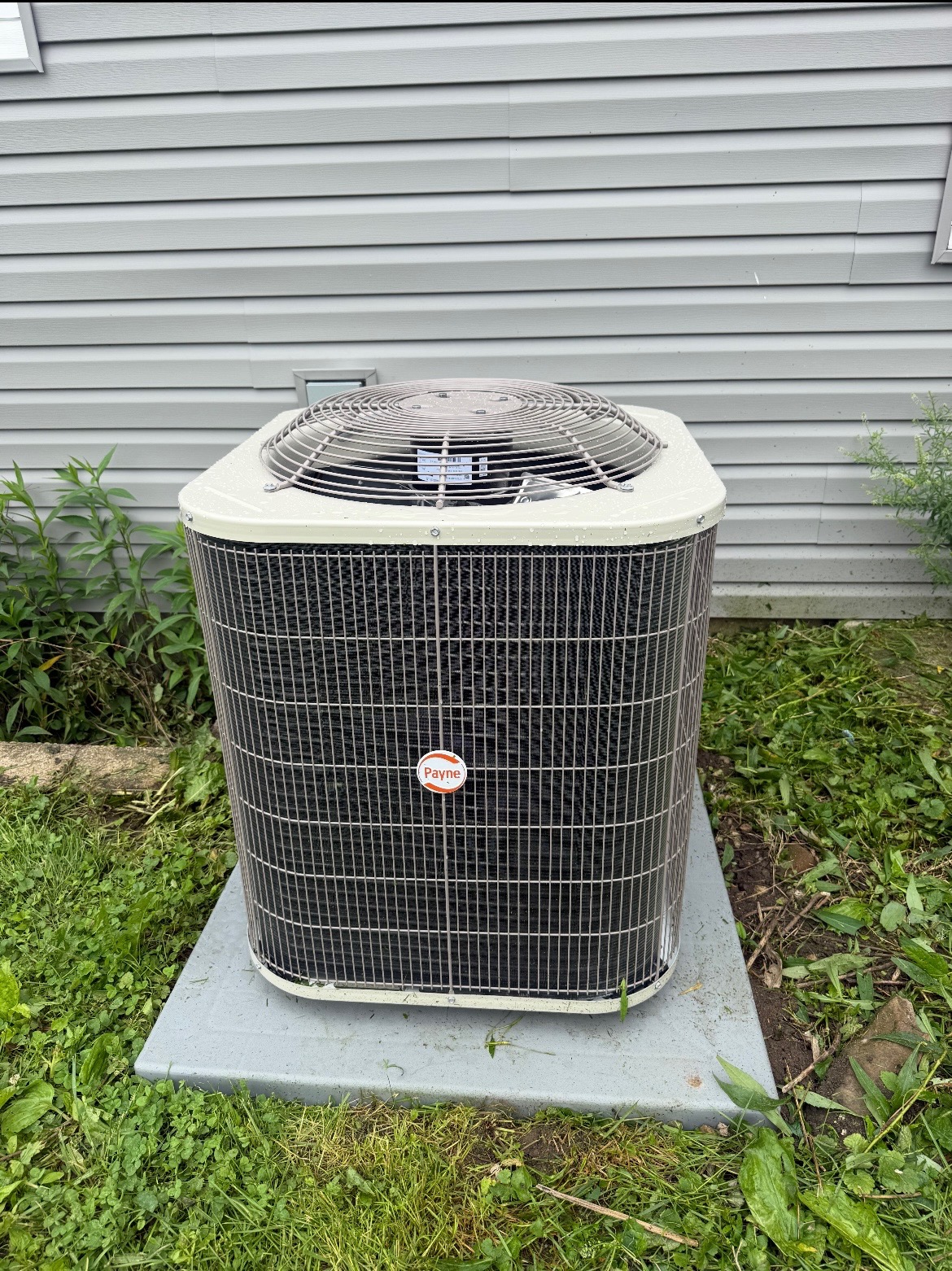 Payne AC condenser set on a leveled pad