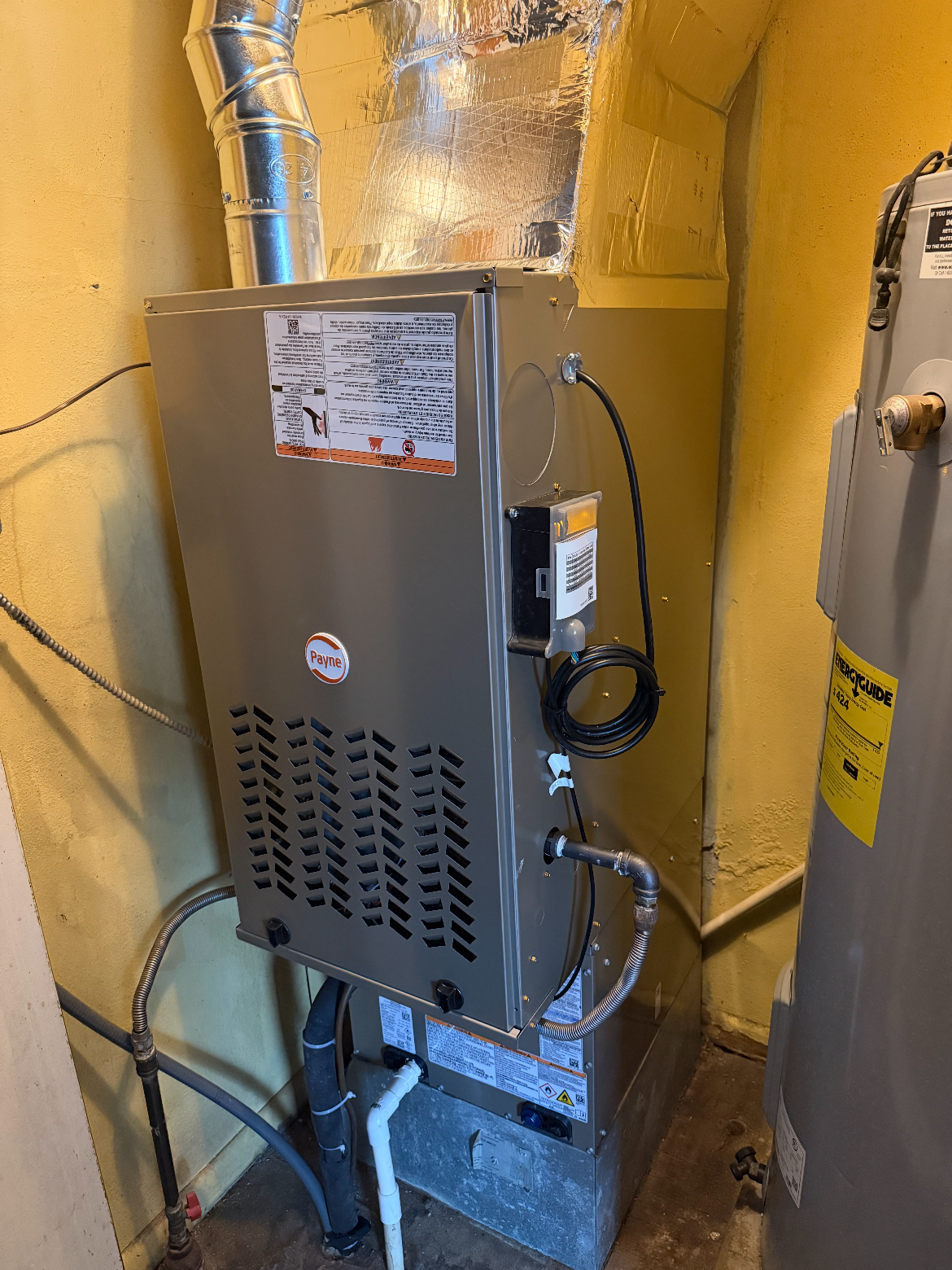 Payne furnace installed in a utility room